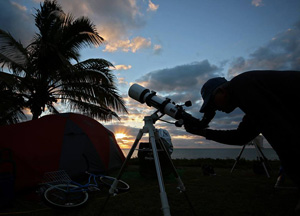 Greg Bragg aims his telescope during the 2016 Winter Star Party on Scout Key, where more than 600 amateur and professional astronomers view the heavens. 
